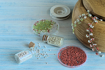 Beads.  Beads for needlework on a blue wooden background.