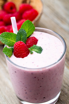 Raspberry milk shake with mint decor.