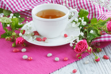 Cup of tea and roses