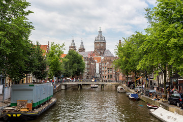 Naklejka premium Canal and St. Nicolas Church in Amsterdam