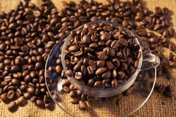 Roasted coffee beans on sackcloth warm tone