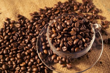 Roasted coffee beans on sackcloth warm tone
