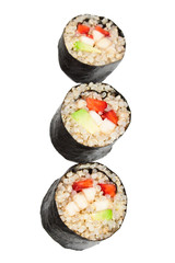 Close up image of sweet quinoa sushi rolls with fruits isolated on white background.