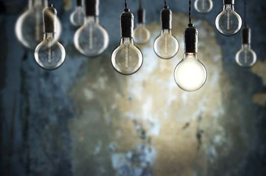 Idea and teamwork concept Vintage  bulbs on wall background