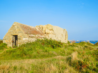 Obraz premium Ancient stone barn on the Guernsey Island