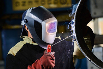 Industrial steel welder in factory