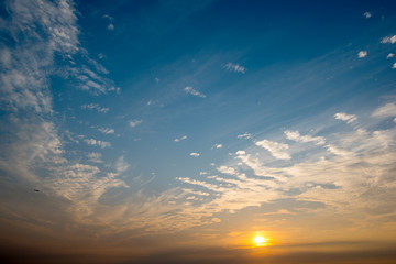 Evening sky with clouds and sun