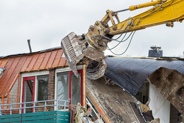 Demolition crane dismantling a building