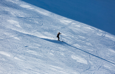 Skiers sliding from mountains