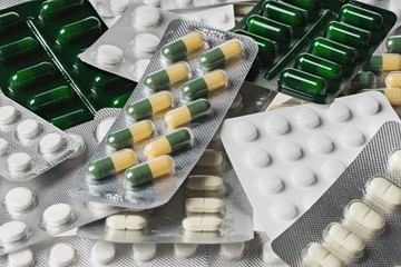 Many medicine pills and tablets. Colorful capsules and tablets  closeup