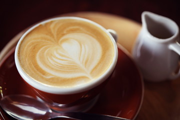 Hot Latte Coffee in coffee shop on table wooden