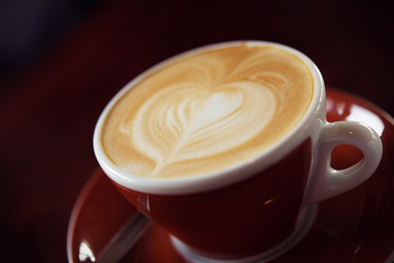 Hot Latte Coffee in coffee shop on table wooden