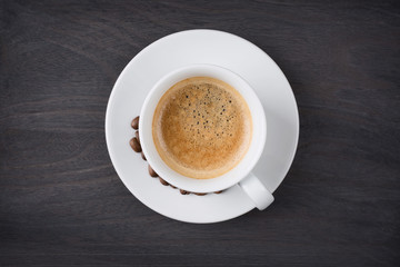 Coffee cup top view on wooden table background