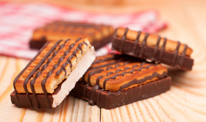 cookie with chocolate on wooden background