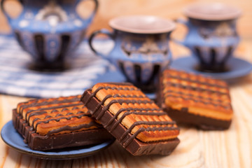 Tea with cookies on wooden background