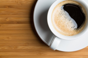 cup of coffee on brown background