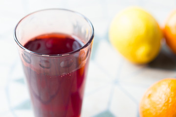 Glass of Grape and Orange Juice on the Table, Close-up