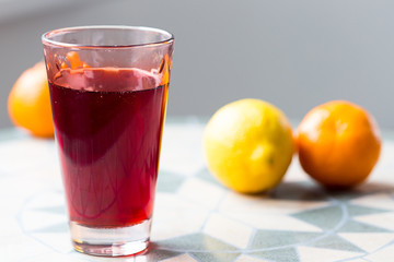 Glass of Red Grape and Orange Juice on the Table, Close-up, Horizontal