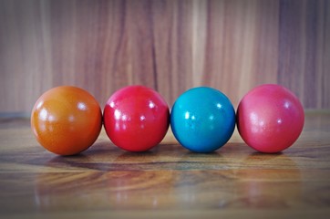 dyed colorful easter eggs on wooden background