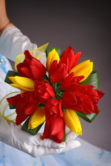 Beautiful wedding bouquet in hands of the bride