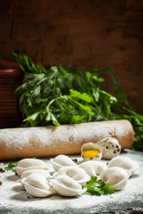 Traditional Russian dumplings with minced meat on the table with