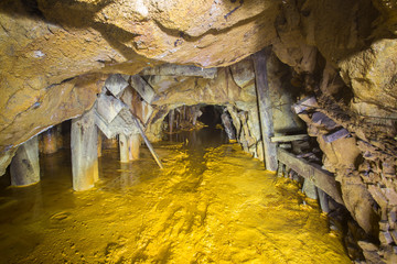 Old abandoned gold mine tunnel passage