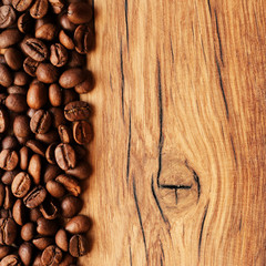 Coffee beans on grunge wooden background