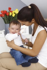 Happy baby boy with mother