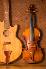 Fototapeta na wymiar Acoustic guitar and violin on old steel background