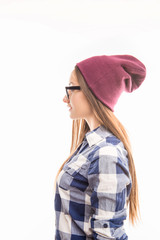 Side view photo of girl in glasses and violet cap