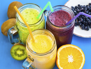 Healthy juices drinks with kiwi,blueberries and orange