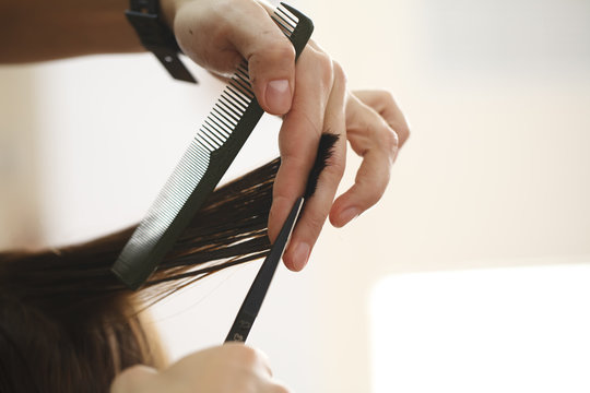 Stylist Hairdresser Doing Haircut