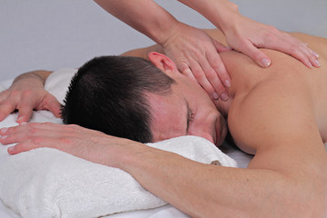 Fototapeta na wymiar Man having massage. Relaxation, body care treatment, spa, wellness concept