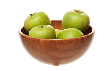 green apples on wooden plate