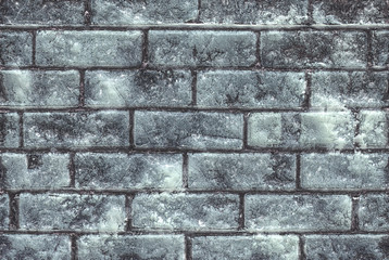 Close up of glossy light blue green stone wall with cracks for u