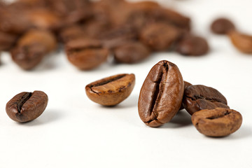 roasted coffee beans on a white background, selective focus.