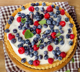 Tart with raspberries and blueberries.