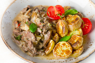 Beef stroganoff with roasted potatoes.