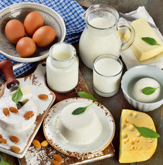 Tasty healthy dairy products on a wooden table