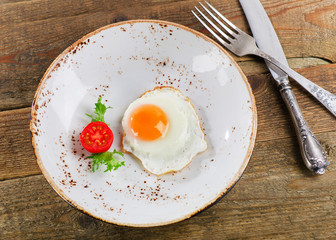 Fried egg for traditional breakfast.