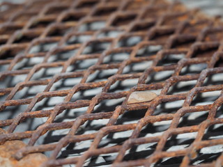 Rusted steel drain grate closeup