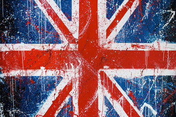 Painted concrete wall with graffiti of British flag. Grunge flag of United Kingdom. Union Jack