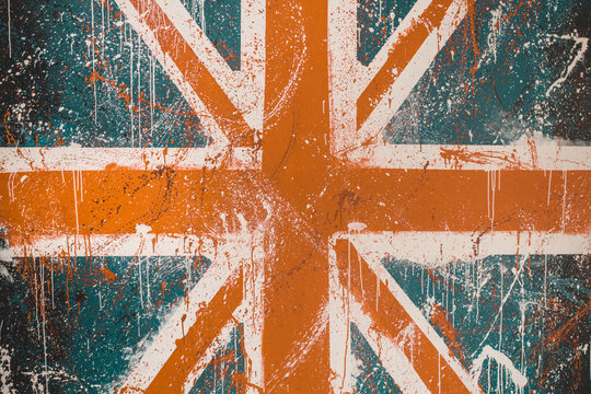 Painted Concrete Wall With Faded Graffiti Of British Flag. Grunge And Vintage Flag Of United Kingdom. Union Jack