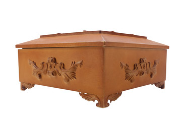 Isolated closed wooden casket with ornaments angle view.