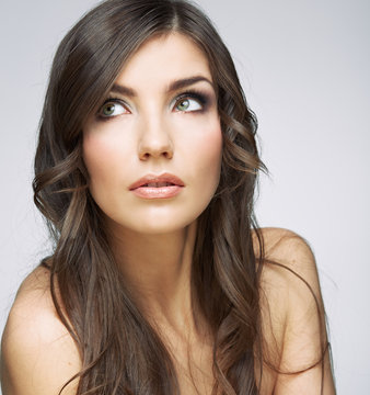Woman face close up beauty portrait. Girl with long hair lookin