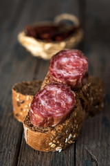 Sausage pieces with bread on paper