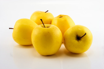 Yellow apples on the white background. Isolated