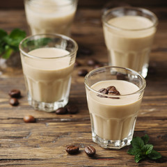 Cold cream with coffe and mint on the wooden table