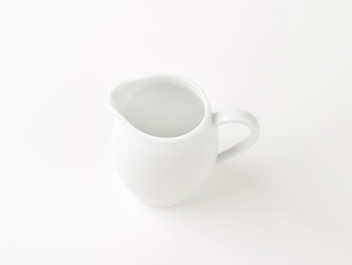 white cream jug
