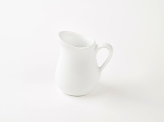 white cream jug